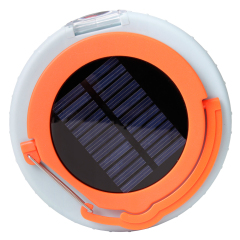 Top-down view of the camping lantern focused on the integrated solar panel for automatic charging.