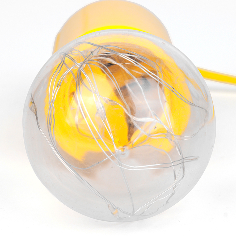 A close-up view looking into the clear bulb dome showing the internal fairy LED string lights.