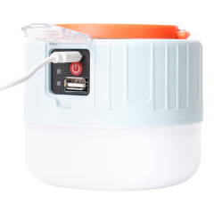 Close-up view of the solar lantern connected to a USB cable for charging, highlighting the dual charging capability.
