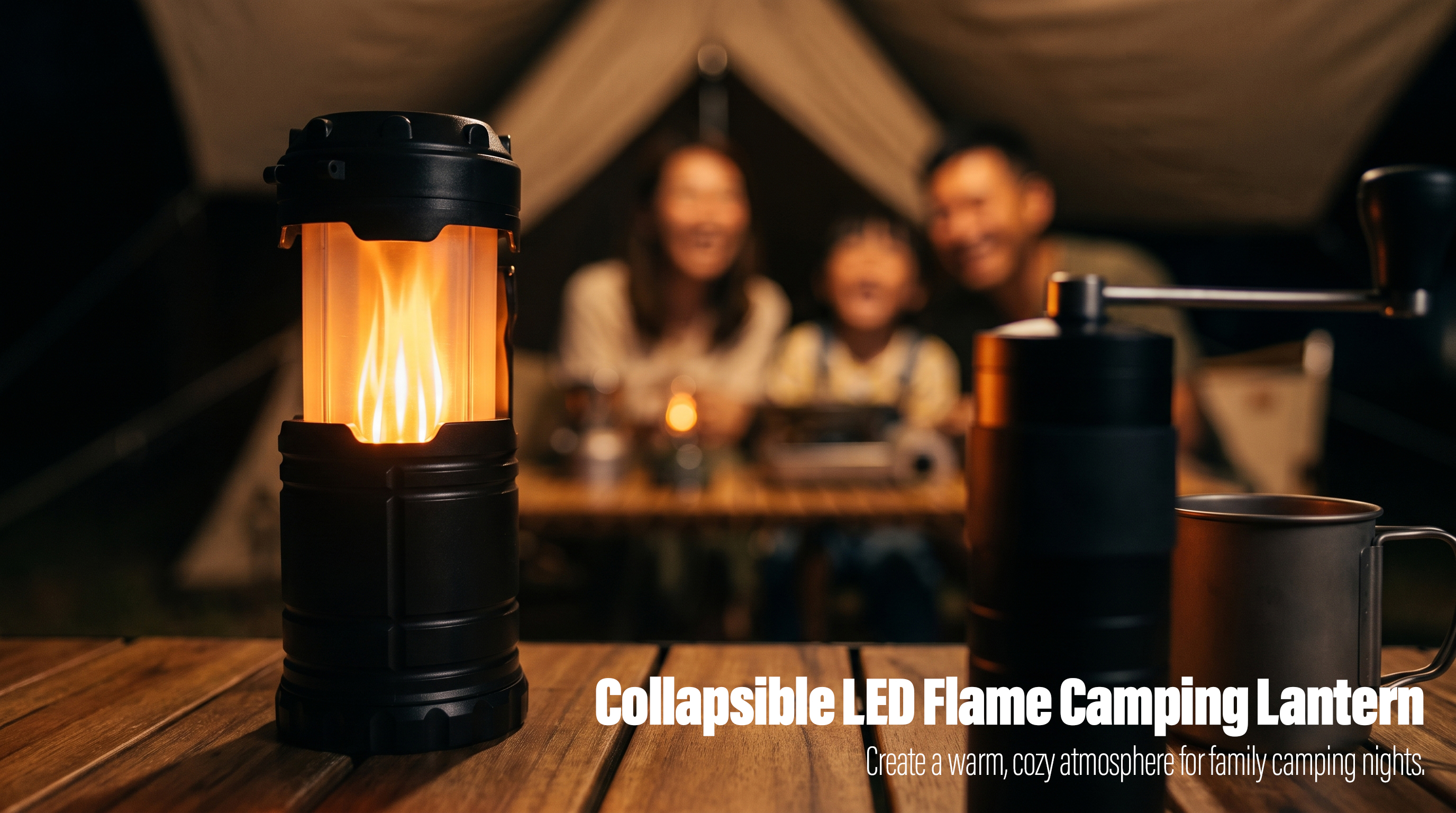 A glowing black collapsible LED flame camping lantern on a wooden table with a family and tent blurred in the background.