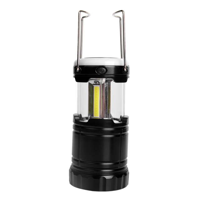 Close-up view of the extended camping lantern with its two metal hanging handles raised.