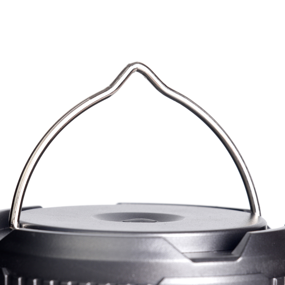 Close-up view of the raised metal wire hanging handle on top of the lantern.