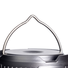 Close-up view of the raised metal wire hanging handle on top of the lantern.