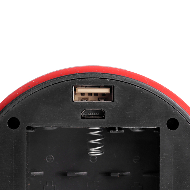 Close-up view of the USB port and internal spring contact inside the lantern base.