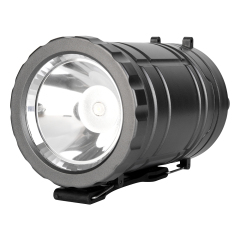 Close-up view of the bottom flashlight searchlight lens and reflector cup on the collapsible lantern.