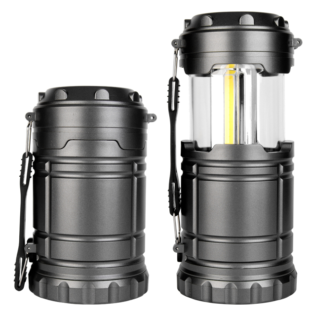 Side-by-side comparison of the dark grey camping lantern in its collapsed state and extended open state.