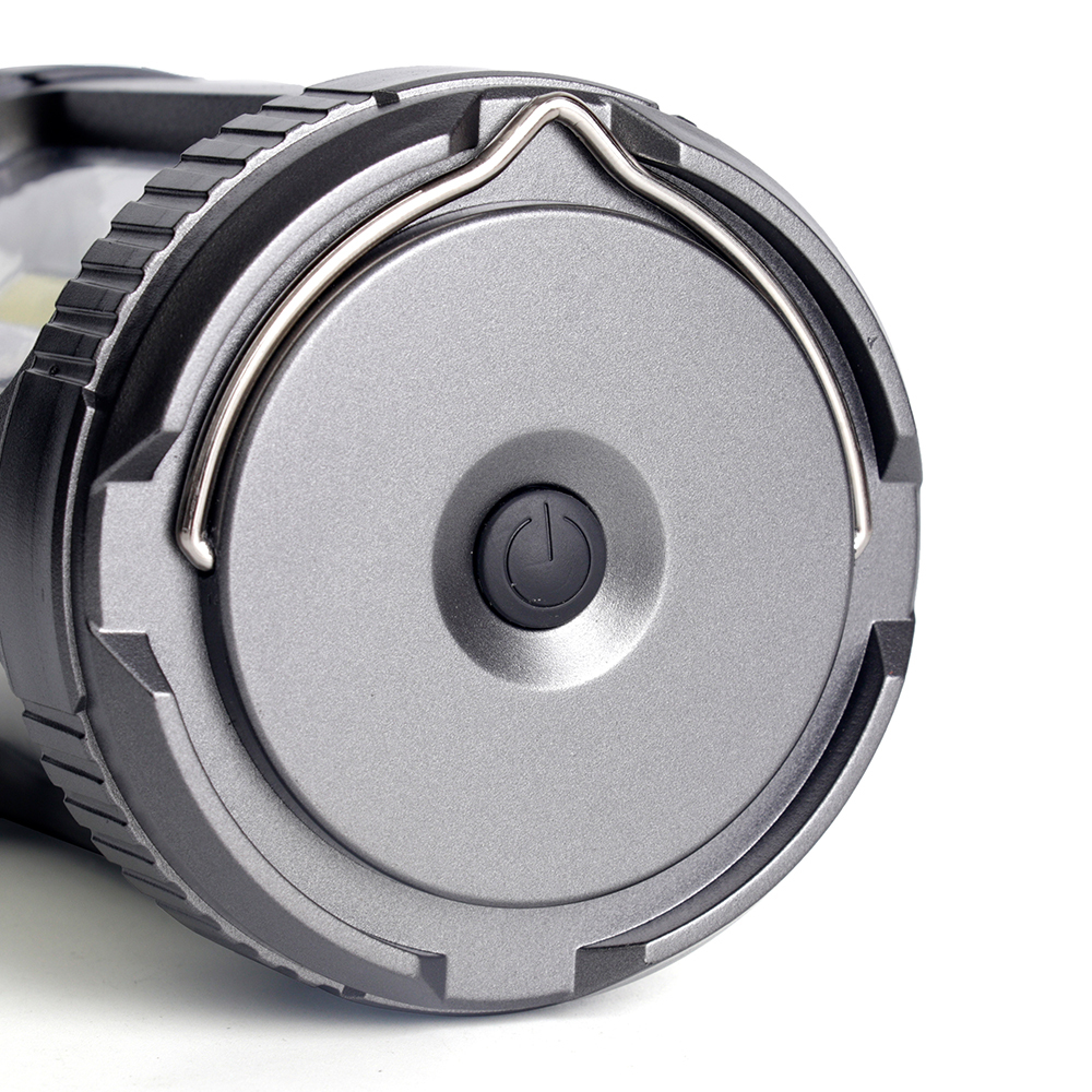 Bottom view of the lantern showing the push-button power switch and folded hanging ring.