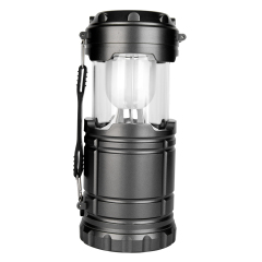Front view of the extended collapsible camping lantern with a white frosted diffuser shade.