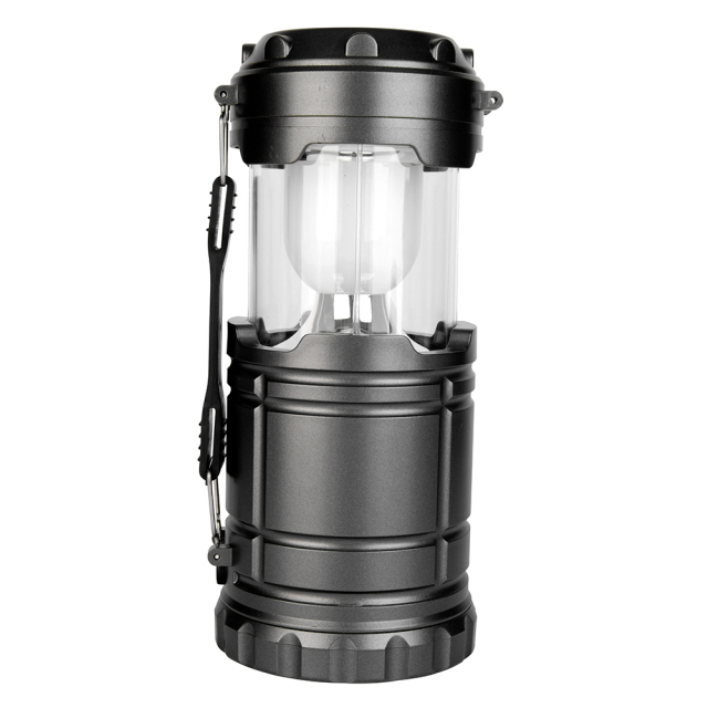 Front view of the extended collapsible camping lantern with a white frosted diffuser shade.