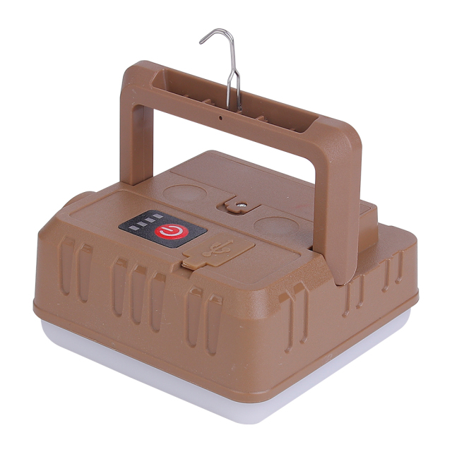 Perspective view of the brown LED camp light with its carrying handle raised and hanging hook extended.