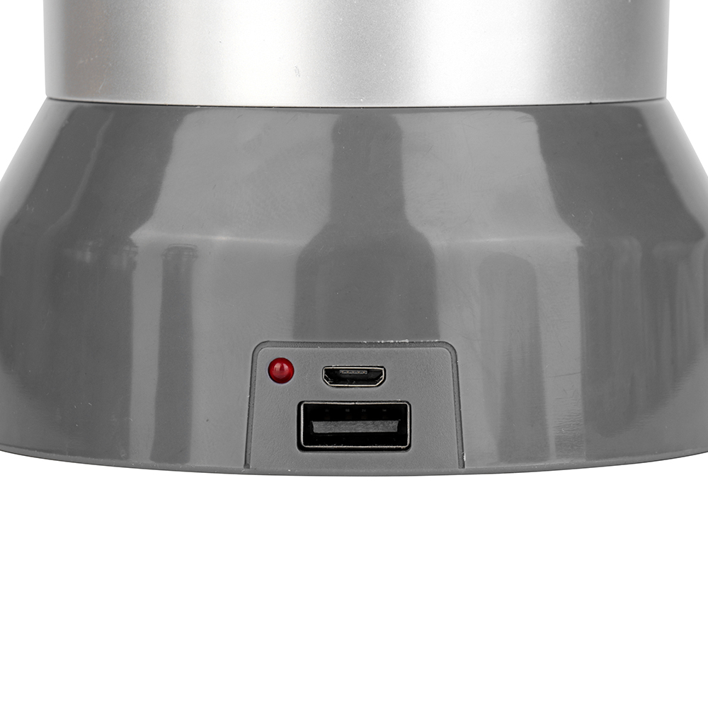 Detailed view of the USB charging port, power output port, and LED status indicator light on the base.