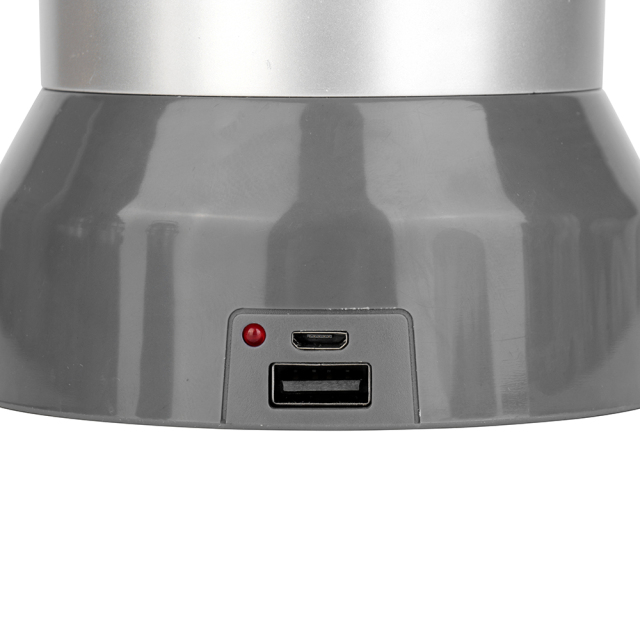 Detailed view of the USB charging port, power output port, and LED status indicator light on the base.