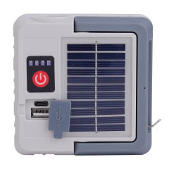 Top view showing the solar charging panel, power switch, and USB interface of the camping light.