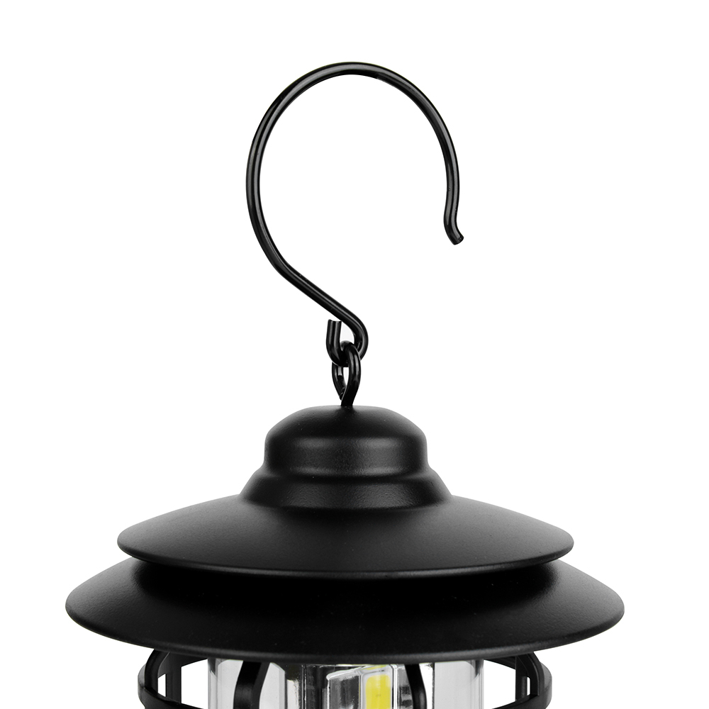 Close-up view of the S-shaped hanging hook on top of the vintage camping lantern.
