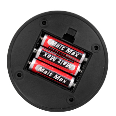 Bottom-up close-up view of the battery compartment showing three AA batteries inside the lantern.