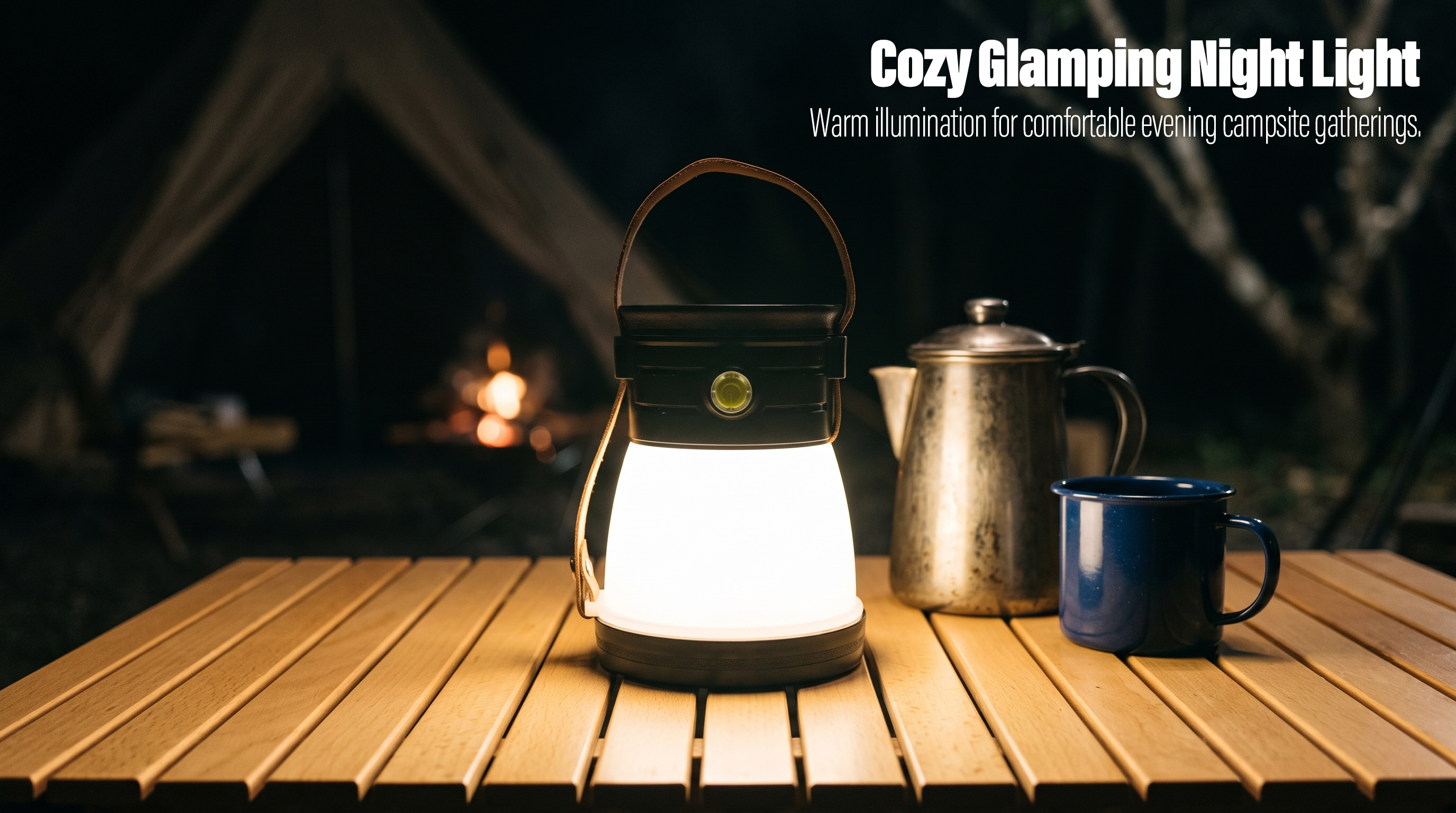 A portable LED camping lantern with a leather handle glowing warmly on a wooden table outdoors next to a kettle and blue mug at night.
