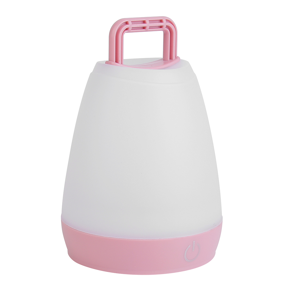 Slightly angled view of the pink ambient LED night light with a raised top handle.