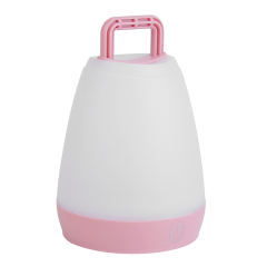 Slightly angled view of the pink ambient LED night light with a raised top handle.