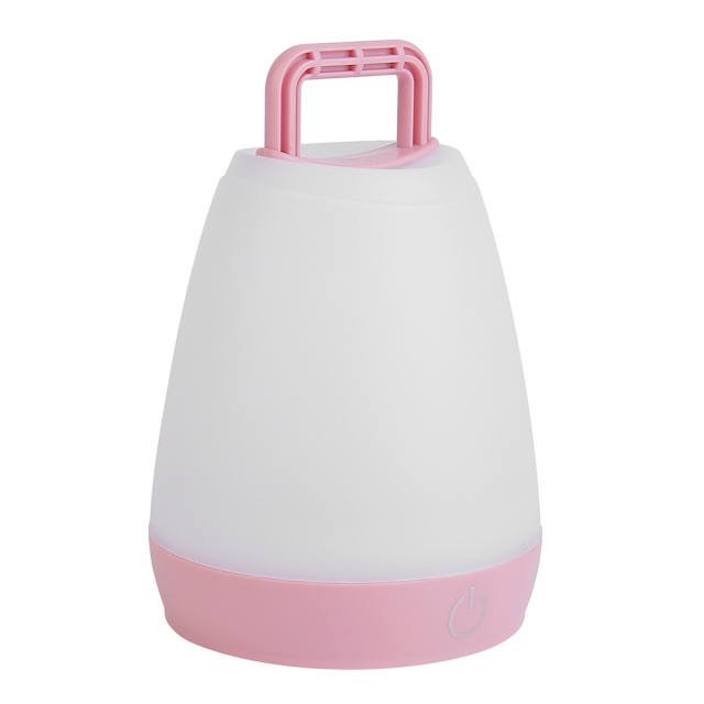 Slightly angled view of the pink ambient LED night light with a raised top handle.
