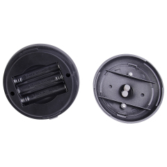 Internal view of the battery-operated tent light showing the 3 x AAA battery compartment opened.