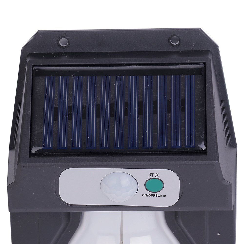 Close-up view of the top solar charging panel, motion sensor sphere, and power button on the wall light.