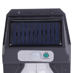 Close-up view of the top solar charging panel, motion sensor sphere, and power button on the wall light.