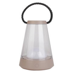 Front view of a portable LED camping lantern featuring a brown base, transparent shade, and top carrying handle.