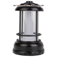 Full front view of the black portable vintage outdoor lantern with front button and hanging hook.