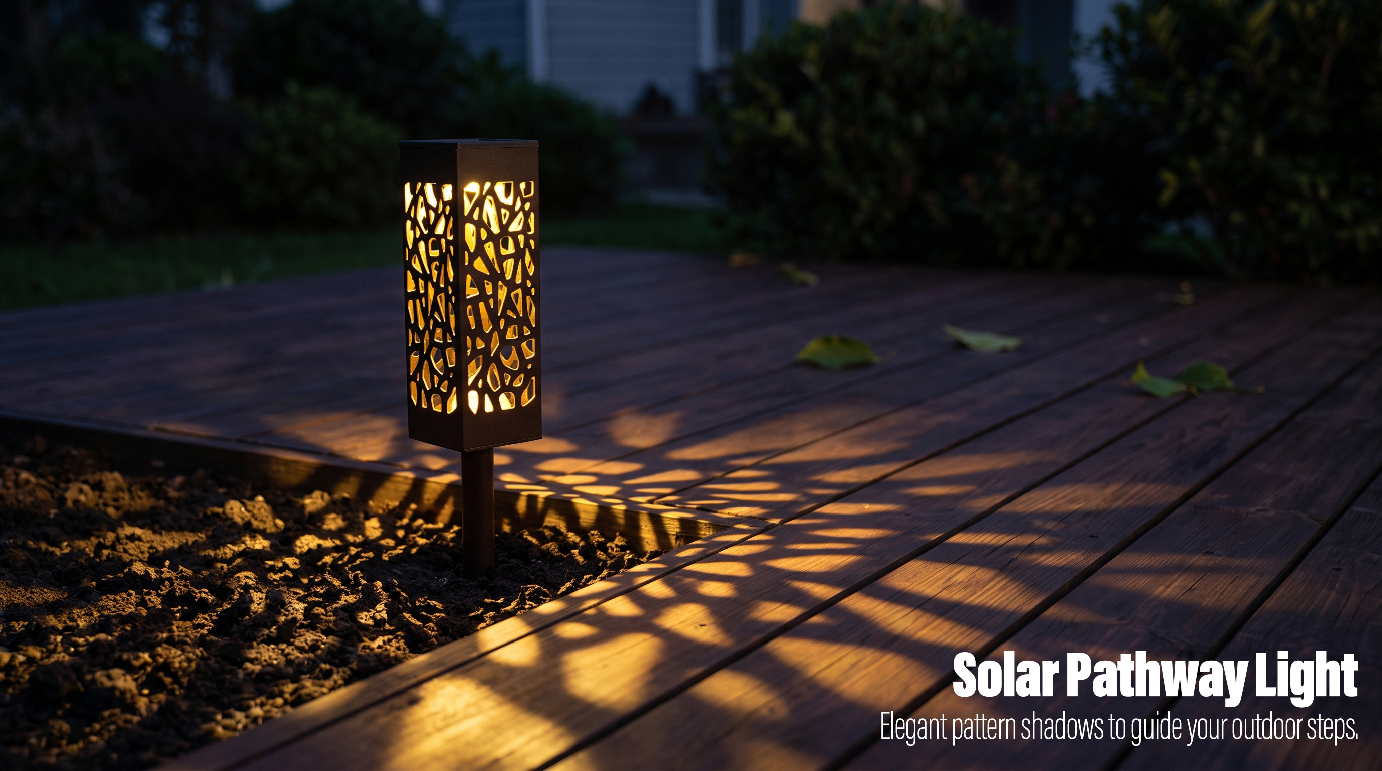 A black rectangular solar pathway light glowing warmly and casting geometric shadow patterns on a wooden deck at night.