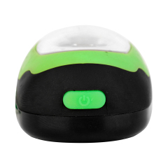 Close-up view of the green rubber push button switch on a mini COB keychain light.