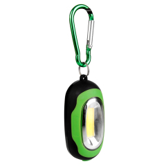 Angled view of a green mini COB LED keychain light hanging from its carabiner clip.