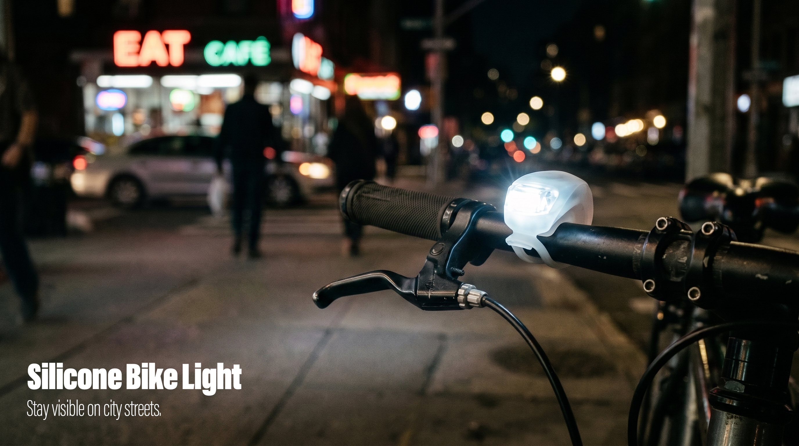 A translucent silicone LED bike light mounted on a handlebar, glowing on a city street at night.