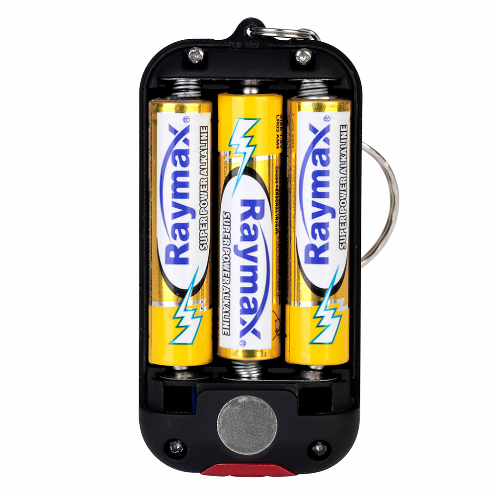 Back view of a COB keychain light with the cover removed to show 3 AAA batteries installed.