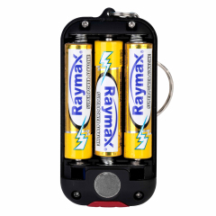 Back view of a COB keychain light with the cover removed to show 3 AAA batteries installed.