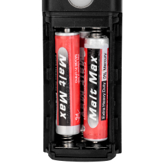 Open battery compartment of an LED bike front light loaded with AAA batteries.