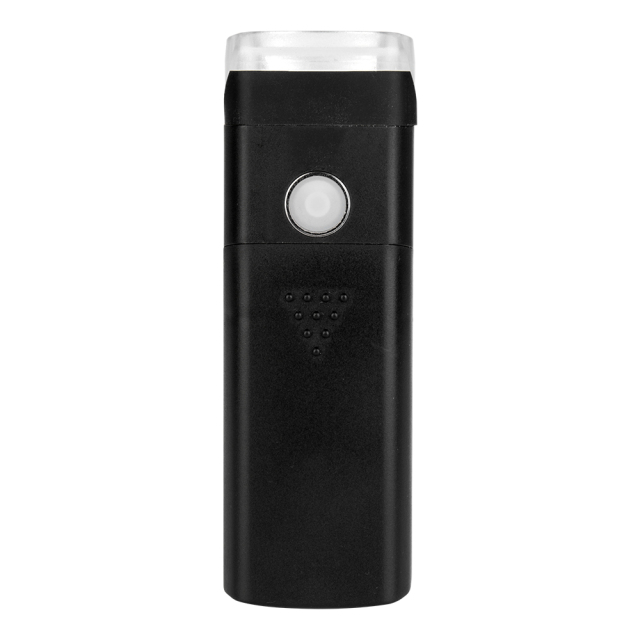 Top view of an LED bike front light showing its power switch button.