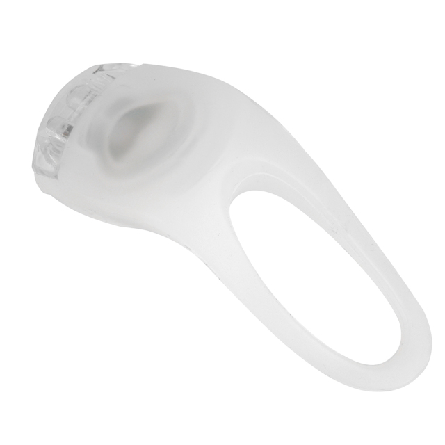 Top-side view of an LED bike light focusing on its soft silicone power button.