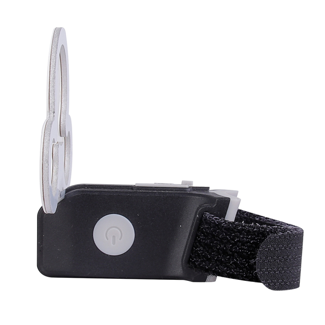 Side view of the bike light mounting bracket showing the power button and strap.