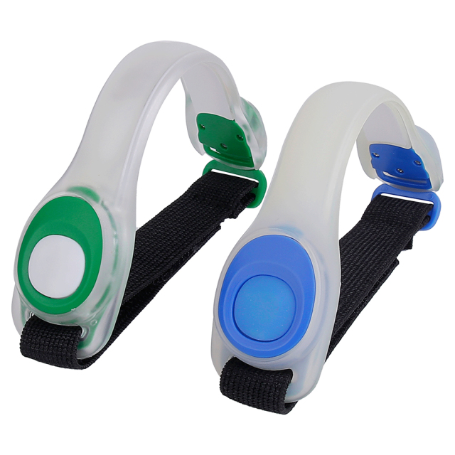 Green and blue LED silicone safety armband lights with adjustable elastic straps.