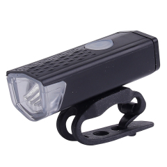 Compact black rechargeable LED bicycle front light with integrated silicone mounting strap.