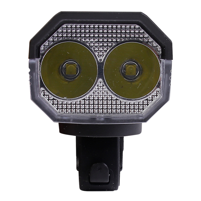 Close-up front view of a bicycle headlight showing two XTE LED lenses.