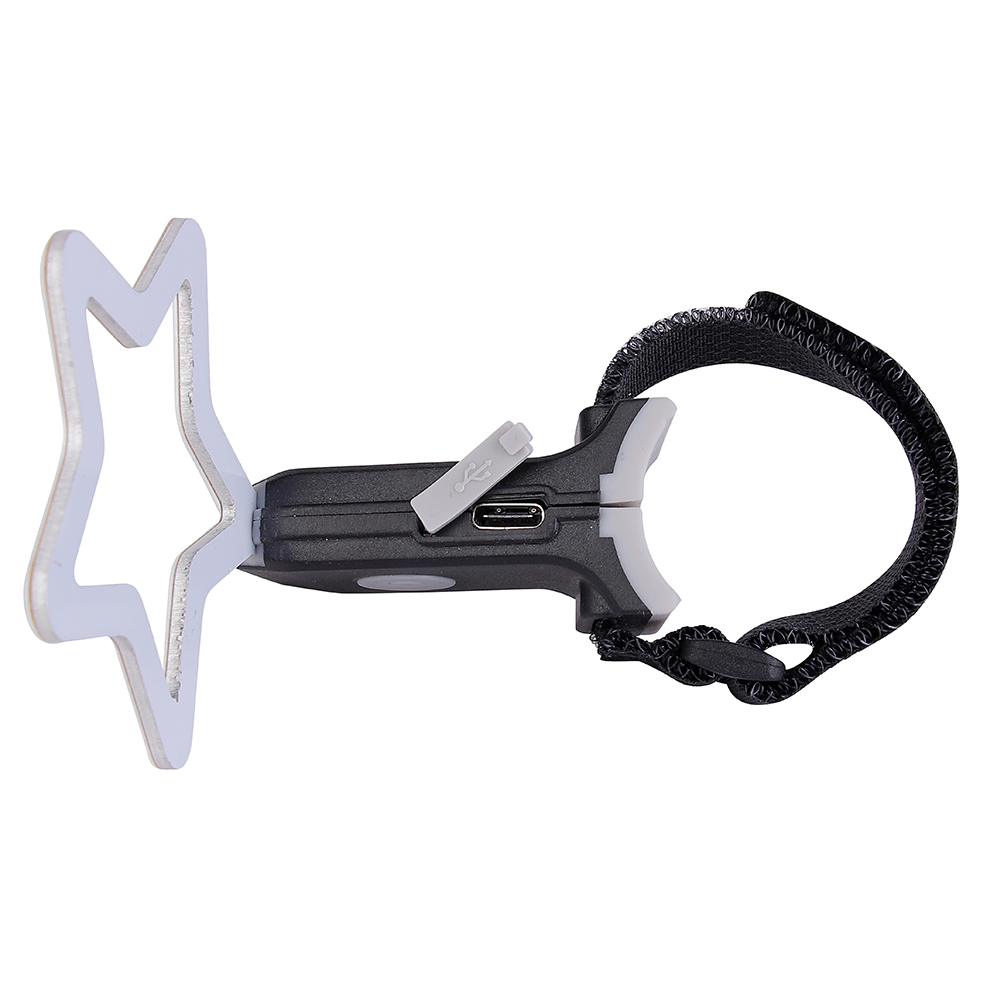 Side angled view of a star-shaped LED bike rear light with its mounting strap.