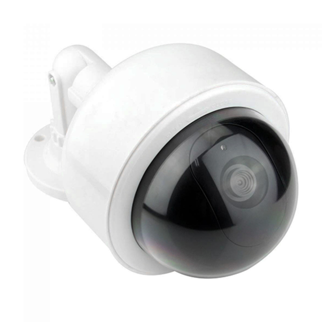 Close-up view of the black dome and realistic camera lens on a white fake outdoor security camera.