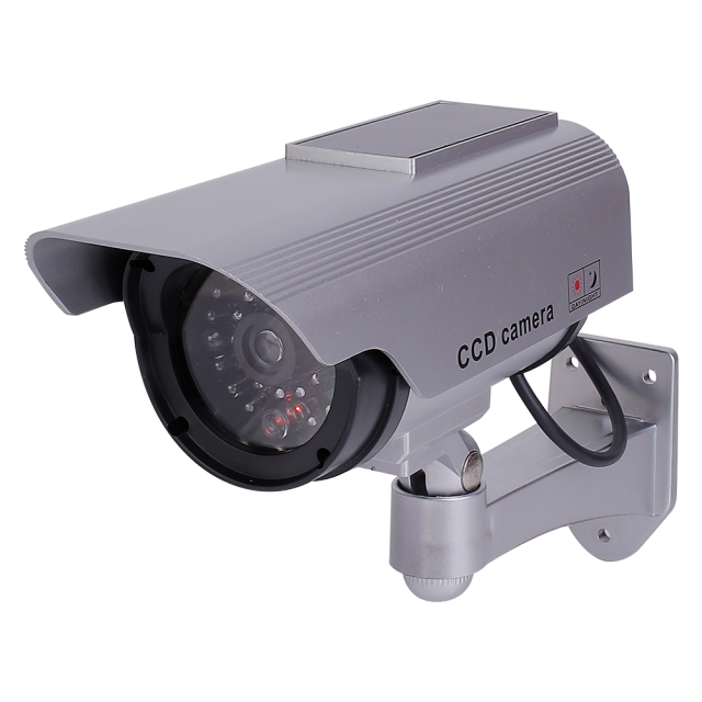 Front perspective view of a silver solar-powered dummy bullet security camera with simulated lens array.