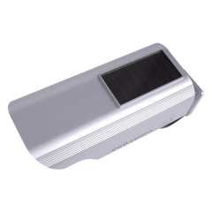 Top angled perspective view of a silver solar-powered dummy security camera housing.