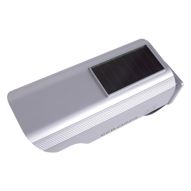 Top angled perspective view of a silver solar-powered dummy security camera housing.