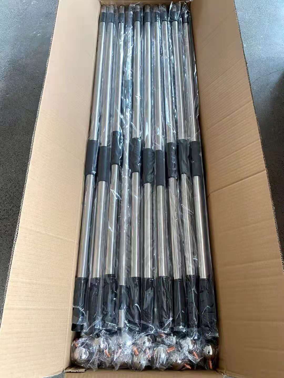 Stainless steel handheld flag poles individually wrapped and packed in a bulk shipping carton