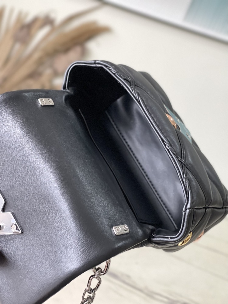 The LV GO-14 (Twist) series Malletage with diamond quilting and studs.