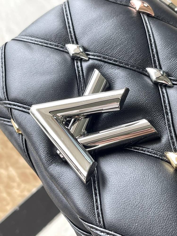 The LV GO-14 (Twist) series Malletage with diamond quilting and studs.