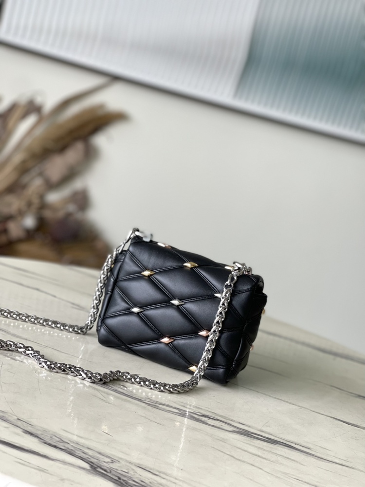 The LV GO-14 (Twist) series Malletage with diamond quilting and studs.